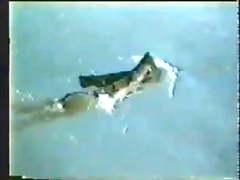 A amputee swimming girl with hairy armpits